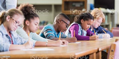Elementary School Students Taking A Test Stock Photo Download Image
