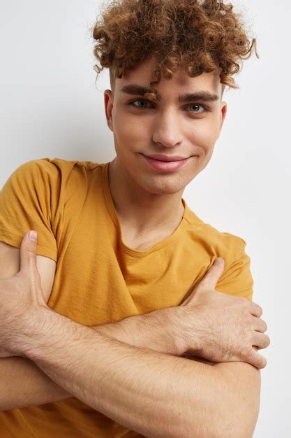 Premium Photo Handsome Young Man In Yellow Tshirts Gesture Hands