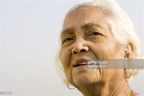Outdoor Portrait Of Cheerful Senior Asian Indian Woman Lady Female High