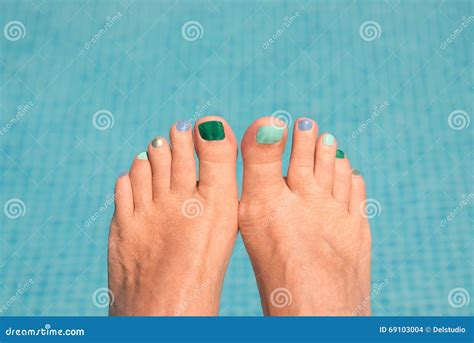 Close Up On Woman Bare Feet Blue Water Stock Photography