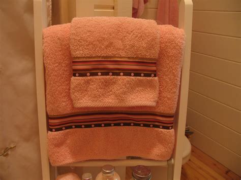 Two to use and two in the wash/clean for later. Decorative bathroom towels with ribbon border