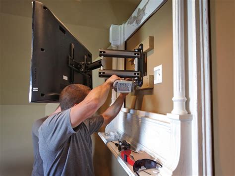Once the tv mount is aligned, drill holes on the wall where the mount would be. How to Build a TV Wall Mount Frame | how-tos | DIY