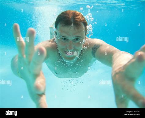 Man Swimming Under Water In Swimming Pool Stock Photo Alamy