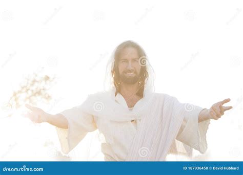 Jesus Christ Smiles From Heaven With Arms Outstretched In Light Stock