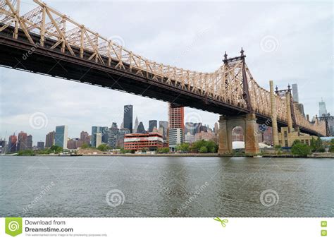 Queensborough Bridge In Midtown Manhattan With New York City Skyline