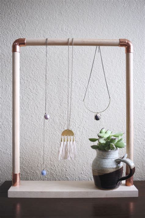 Easy do it yourself jewelry stand. DIY Jewelry Stand From Wood Dowels and Copper Pipes