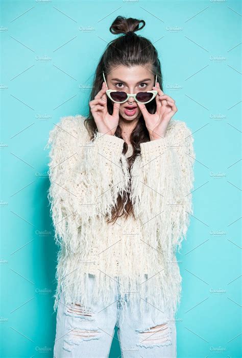 Portrait Of Cheerful Fashion Hipster Girl Going Crazy Making Funny Face And Dancing Blue Color