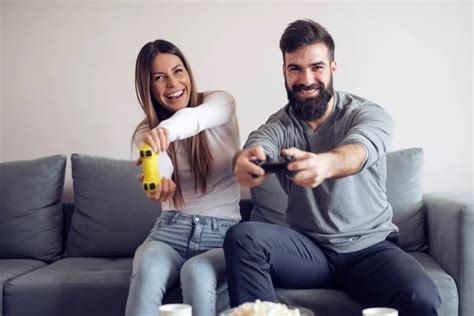 Happy Couple Having Fun With New Game Consoles Trends Technology