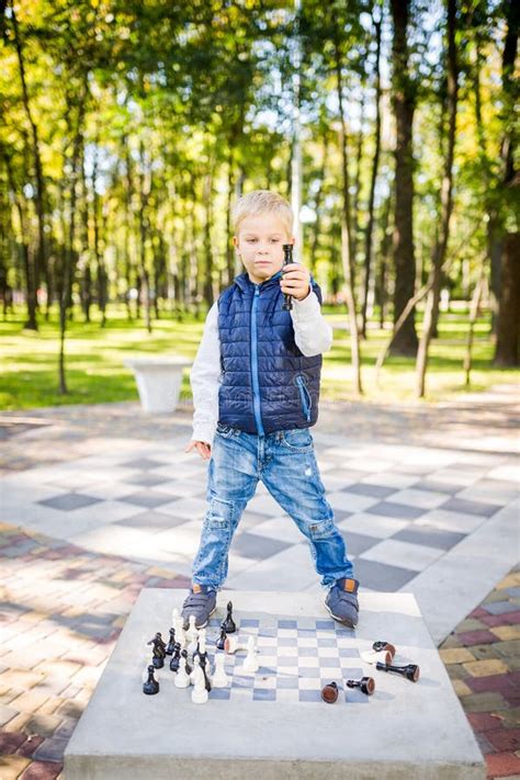 Child Playing Chess On Board Game Outdoor Hobby Club Children Playing