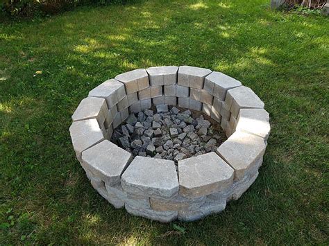 A fire pit should sit low to the ground, with walls rising no more than a foot off the ground. Create Your Own Fire Pit | MyCoffeepot.Org
