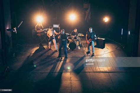 Rock And Roll Band Performing Hard Rock Music On Stage High Res Stock