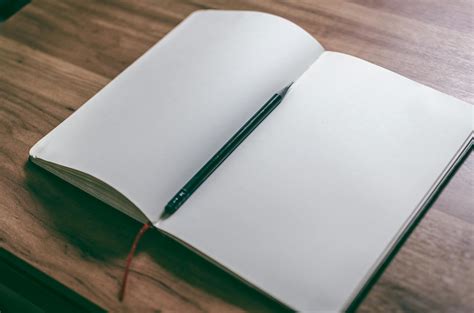 White Book Page With Black Pen · Free Stock Photo