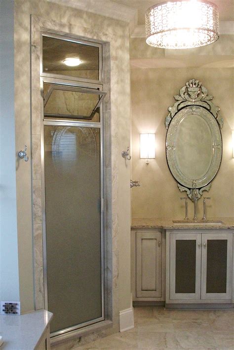 fully framed steam shower enclosure door with above transom with fade to clear privacy glass