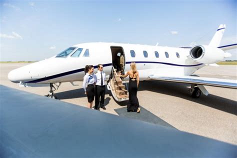 elegant woman boarding private jet at terminal stock image everypixel