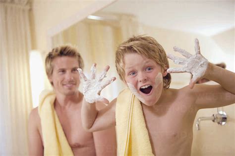 Father And Son In Bathroom Stock Photo