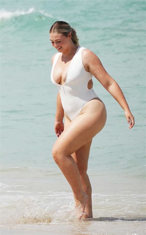 Iskra Lawrence In A White Swimsuit Does A Photoshoot On The Beach In