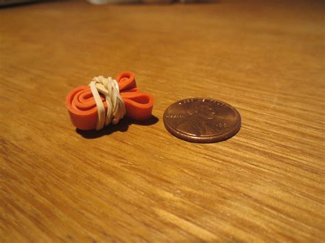 You take two rubber bands and tie them together as in the picture. Rubber band ball FAQs
