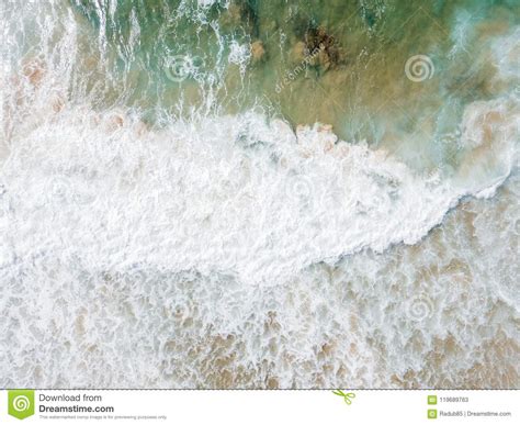 Aerial Panoramic Drone View Of Blue Ocean Waves Crushing On Sandy Beach