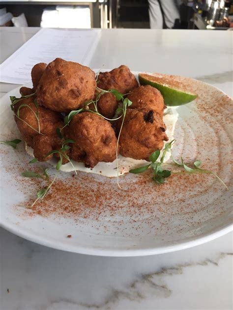 My family went to a nice bbq restaurant here in raleigh for my sister's birthday. Hush puppies with fresh corn and crab salad. A meal in itself - Yelp