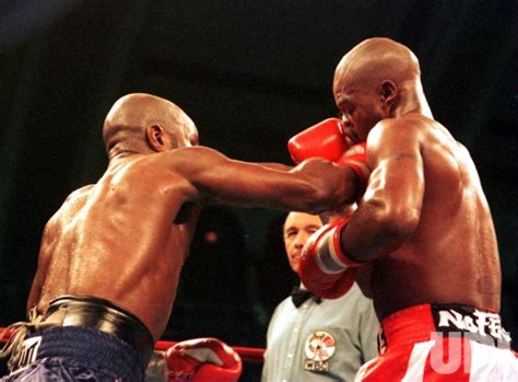 Photo Keith Mullings Connects With A Hard Right To The Chin Of Boxer