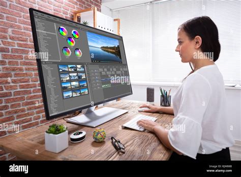 Side View Of Creative Female Editor Editing Video On Computer Over