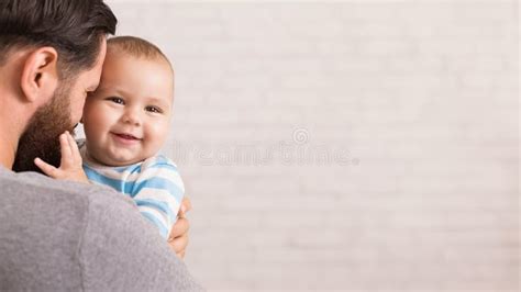 Loving Father Embracing His Cute Baby Son Stock Photo Image Of Baby