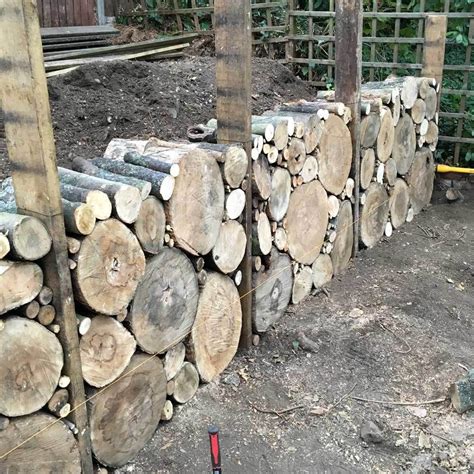 How We Built Our Log Retaining Wall To Hide Two Stumps And Create A
