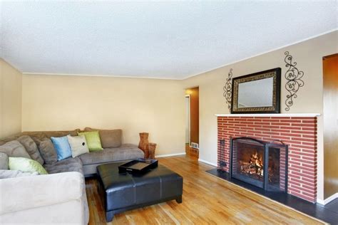 This Simple Living Room Design Also Features A Red Brick Fireplace Home