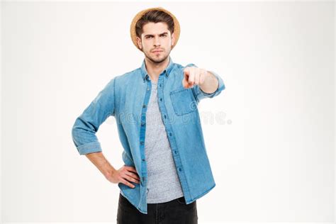 Serious Attractive Young Man Standing And Pointing To Camera Stock