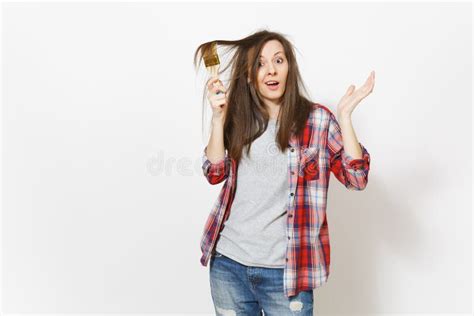 Young Crazy Loony Woman In Casual Clothes Painting Hair With Paint