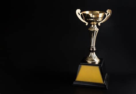 Premium Photo Golden Trophy Over Black Background Winning Awards