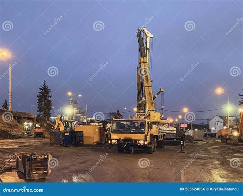 Construction Equipment At The Overpass Repair Site A Tall Yellow