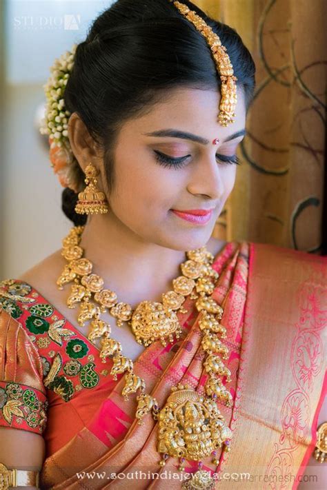 bride in gold temple jewellery south india jewels
