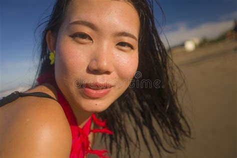 Young Attractive And Happy Asian Korean Woman In Sarong Walking By The Sea Relaxed And Cool