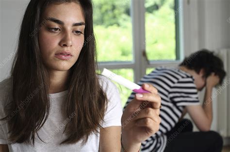 teenage couple with a pregnancy test stock image c026 1772 science photo library