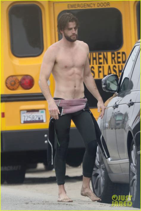 Liam Hemsworth Strips Out Of Wetsuit To Reveal Ripped Abs Photo