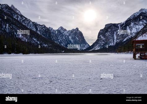 The Frozen Surface Of Lake Dobbiaco In The Middle Of Winter Stock Photo