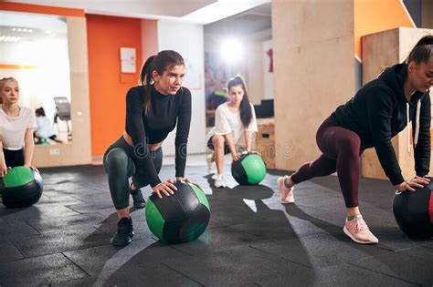 Fit Young Ladies Using Special Gym Balls For Exercising Stock Image