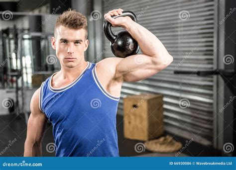 Muscular Man Lifting Heavy Kettlebell Stock Photo Image Of Crossfit