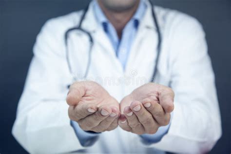 Close Up Of Male Doctor Holding Something In His Hand Stock Photo
