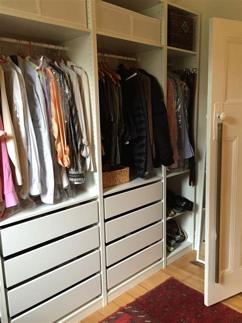 A raked ceiling creates odd spaces, but it also creates for some interesting advantages over standard wardrobes. Part of Stu's wardrobe. So efficient, these IKEA wardrobes ...