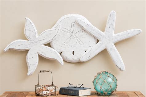 Novica, the impact marketplace, features unique starfish wall decor by some of the most talented artists on life is better at the beach, beach and nautical distressed wood coat rack from indonesia. Beach Wall Art: Antique Sand Dollar and Starfish Wall Hanging