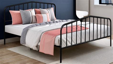 The bed frame is a bit larger than a standard mattress, leaving gaps at the edges and showing the slats. Top 10 Best Platform Metal Bed Frames in 2021 Reviews