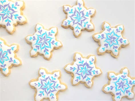 To decorate cookies with solid icing, put some royal icing in a pastry bag with a small plain, round tip. Snowflake sugar cookies. How to decorate using royal icing ...
