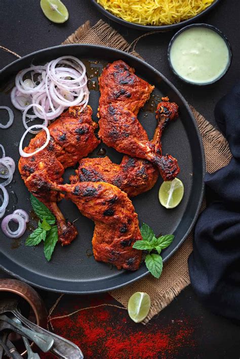 Chicken legs marinated in lemon juice, yogurt, and aromatic spices. Tandoori Chicken Recipe (Authentic, Easy and Best) - Cubes ...