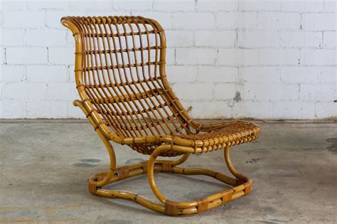 This lounge chair made from reclaimed wood is a sustainable furniture design. Modern Mid Century Rattan Lounge Chair & Ottoman