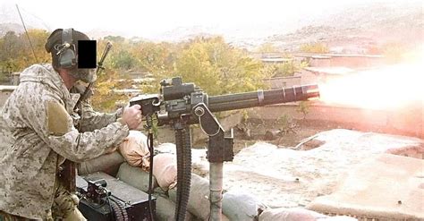 A Graying Us Navy Seal In Afghanistan Firing An M134 Minigun 1080 X