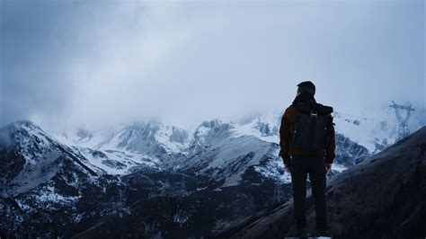 Man Is Standing Alone On Rock In White Mountains Background 4k Hd Alone