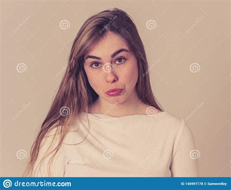 Funny Sad Face Portrait Of Young Teenager Woman Making Cute Sad Facial