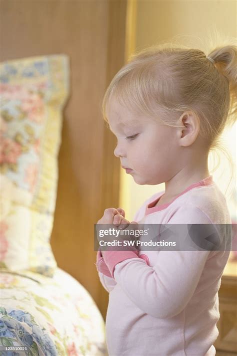 Little Girl Praying Beside Her Bed High Res Stock Photo Getty Images